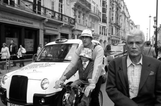 A patriotic father and son cycle down Pall Mall A patriotic father and son cycle down Pall Mall